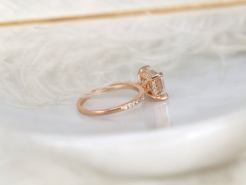 east west set emerald cut solitaire with diamonds on band on white background backview