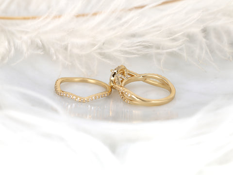 14kt gold bridal set featuring a round halo moissanite engagement ring with a diamond-accented crossover band