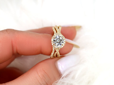 14kt gold crossover bridal set featuring a 7mm round moissanite center stone with halo and diamond accents