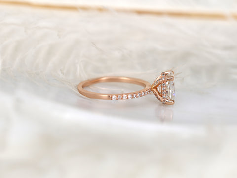 oval solitaire with diamond accents on white background sideview