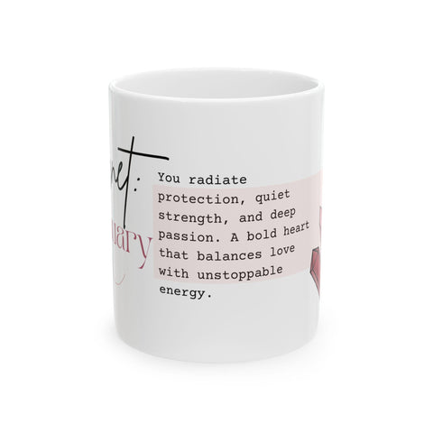 White ceramic mug with a pink crystal design and inspirational text about protection and passion on side