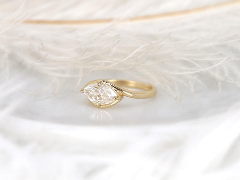 Gold ring with a horizontally set marquise diamond solitaire, elegant design for an engagement or milestone gift.