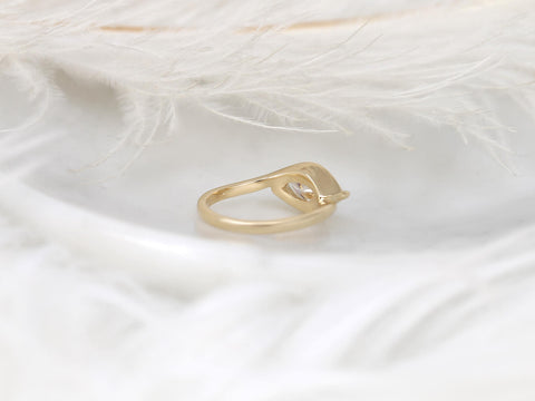 Delicate 14kt gold ring with a horizontally set marquise diamond solitaire on soft white fabric background.