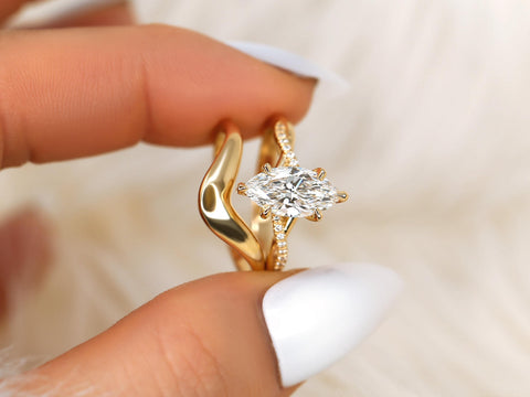 1.50ct Petite Tula 12x6mm & Merida 14kt Diamond Crossover Marquise Bridal Set between fingers
