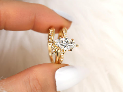 1.50ct Petite Tula 12x6mm & Lonnie 14kt Diamond Crossover Marquise Bridal Set held between fingers