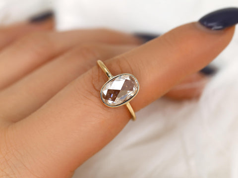 oval rose cut ring on pointer finger in yellow gold