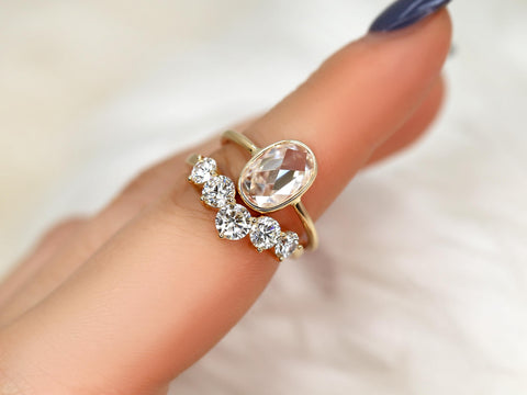 rose cut moissanite oval bezel ring with 5 stone wedding ring on pointer finger