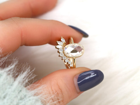 moissanite rose cut ring in oval cut paired with unique curved diamond band between two fingers