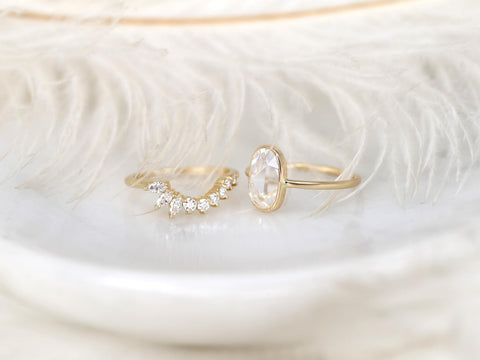 moissanite rose cut ring in oval cut paired with unique curved diamond band on white background side view