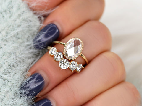 rose cut moissanite oval bezel ring with 5 stone wedding ring on middle finger