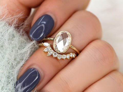 moissanite rose cut ring in oval cut paired with unique curved diamond band on middle finger