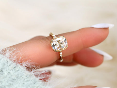 antique cut cushion button back solitaire with diamond accents front view on finger