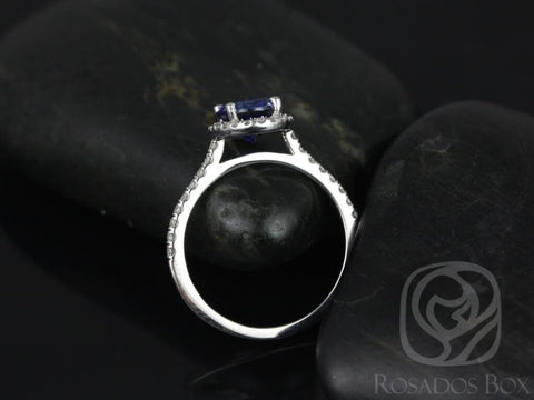 14kt white gold ring featuring an oval blue sapphire center stone with diamond halo on black stones background