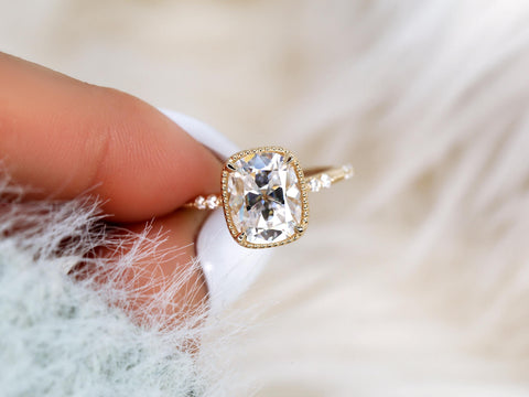 antique cut cushion button back solitaire with diamond accents front view between finger