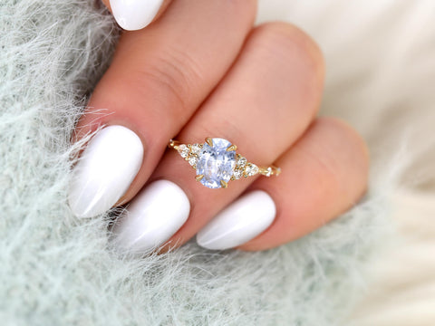 frosted lavender cornflower sapphire oval cluster ring in 14kt gold on ring finger