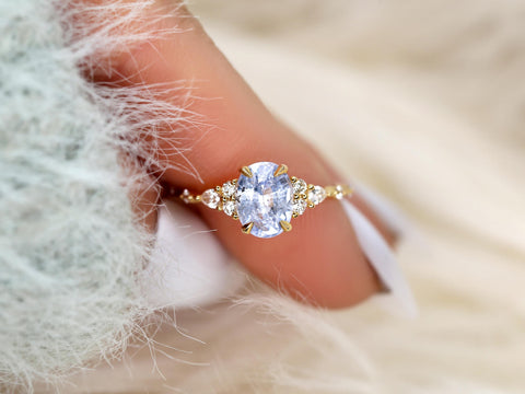 frosted lavender cornflower sapphire oval cluster ring in 14kt gold on pointer finger