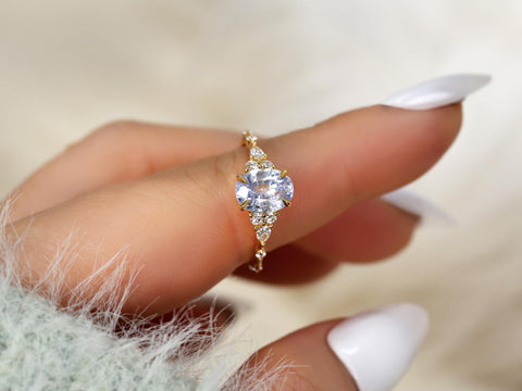 frosted lavender cornflower sapphire oval cluster ring in 14kt gold on pointer finger