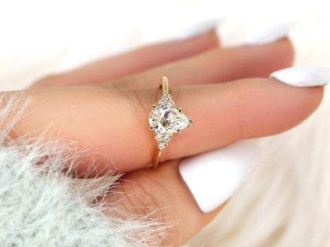 pear cut diamond ring with cluster diamonds on a pointer finger