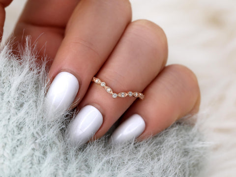 chevron dainty diamond band with vintage detail on ring finger in rose gold