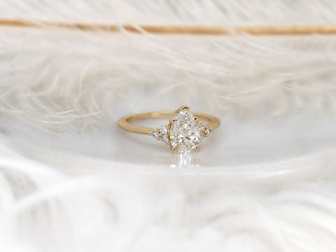 pear cluster ring with yellow gold on white background with feathers angled view