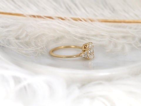 pear cluster ring with yellow gold on white background with feathers side view