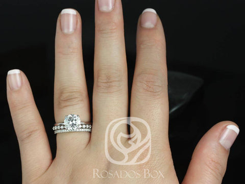 14kt white gold bridal set with round moissanite center and matching diamond-accented wedding band on hand