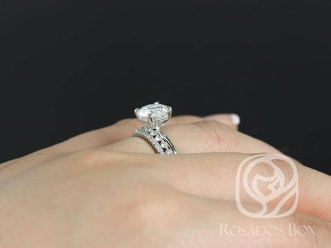 Bridal set featuring round moissanite center stone with hidden halo and pavé diamond accent bands on finger