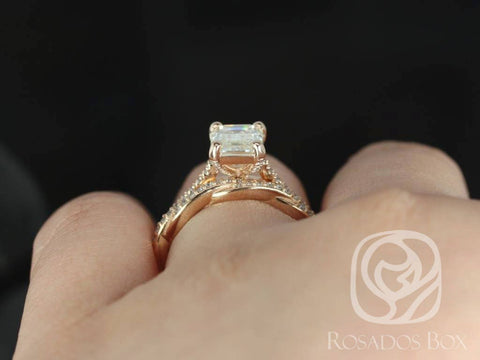 Emerald cut moissanite twist bridal set in 14kt gold worn on a finger