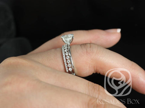 14kt white gold bridal set with round moissanite solitaire and diamond-accented wedding band on finger