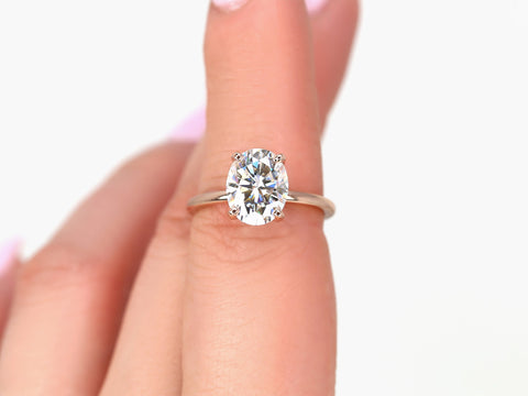 3ct Dakota 10x8mm 14kt Rose Gold Moissanite 4 Prong Oval Engagement Ring