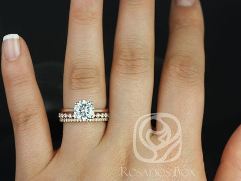 14kt gold bridal set with round moissanite solitaire and delicate diamond-accented wedding band on finger