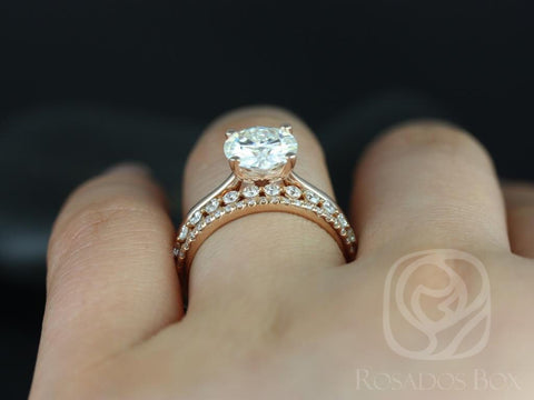 14kt gold bridal set featuring a round solitaire moissanite with diamond-accented wedding band on finger
