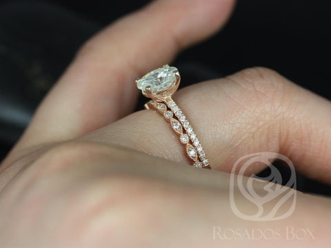 Rose gold bridal set featuring oval moissanite solitaire and pavé diamond-accented wedding band on hand