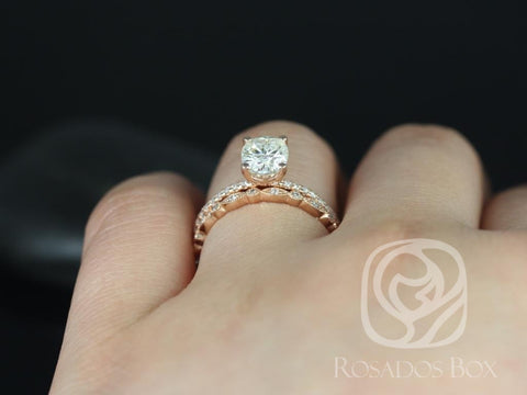 Rose gold bridal set featuring an oval solitaire moissanite with diamond-accented wedding band on finger