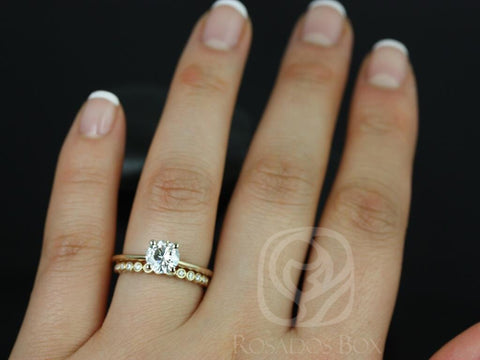 14kt gold bridal set featuring a round moissanite solitaire and petite bubble wedding band on a hand