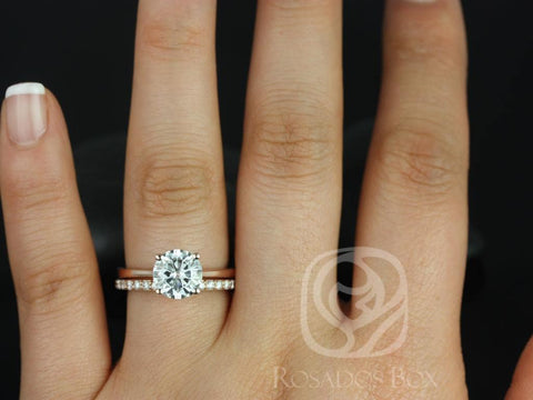14kt gold bridal set with round moissanite solitaire and delicate diamond-accented wedding band on finger