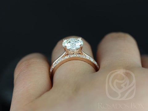 14kt gold engagement ring with round moissanite solitaire and diamond-accented slim band on finger