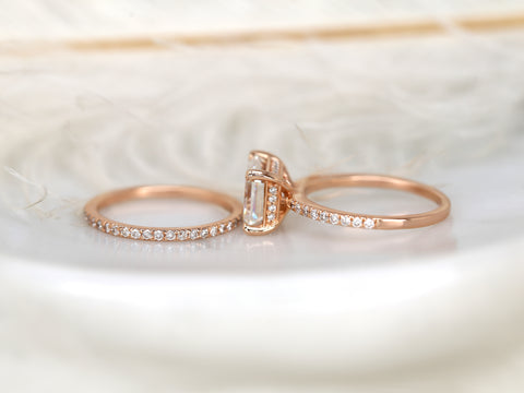 east west set emerald cut solitaire with diamonds on shank and matching diamond band on white background sideways