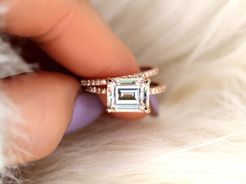 east west set emerald cut solitaire with diamonds on shank and matching diamond band on pointer and thumb