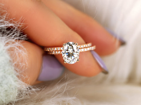 2ct oval moissanite solitaire with accents wedding ring set on pointer and thumb finger