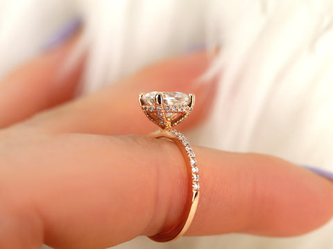 oval solitaire with diamond accents on pointer finger basket view
