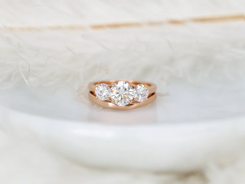 three stone ring wedding set on white background