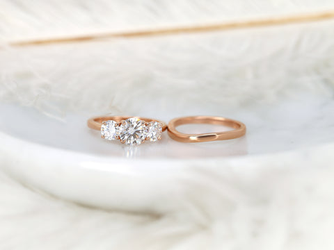 three stone ring wedding set on white background angled