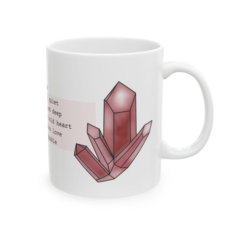 White ceramic mug with a deep red crystal illustration and partial poetic text on a clean background