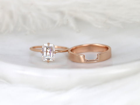14kt rose gold bridal set with an emerald cut solitaire moissanite ring and matching contoured wedding band
