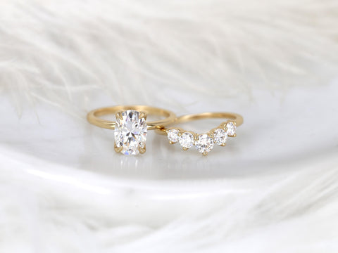 14kt gold bridal set with oval solitaire moissanite and curved band featuring round sparkling stones