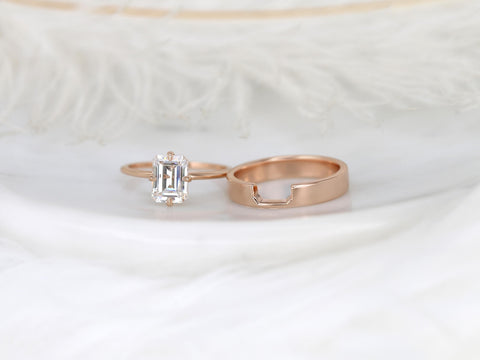 14kt rose gold bridal set featuring an emerald cut moissanite solitaire ring and matching wedding band