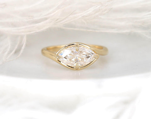 Delicate gold ring showcasing a marquise-shaped diamond set horizontally, perfect for an engagement gift