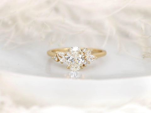 Gold ring with a diamond on a soft white background