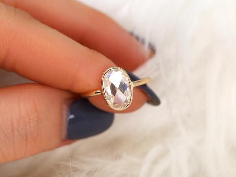 oval rose cut ring on finger in yellow gold